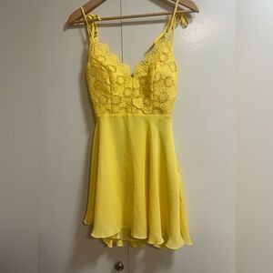 BEBE- Mini bright yellow open back dress